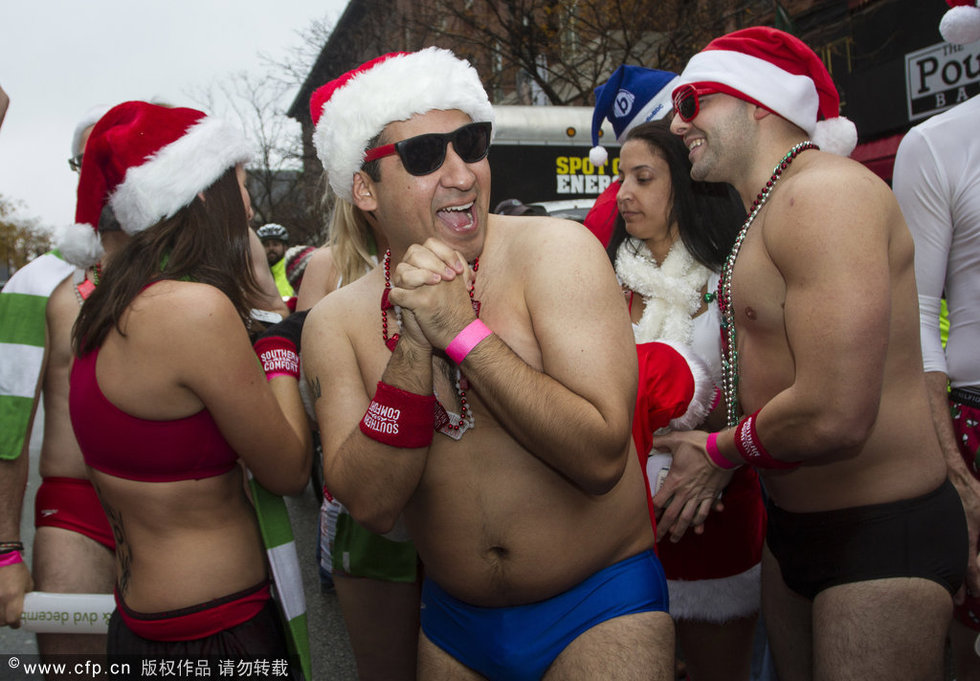 美国圣诞泳装长跑 男女飞奔性感“冻”人(图)图片