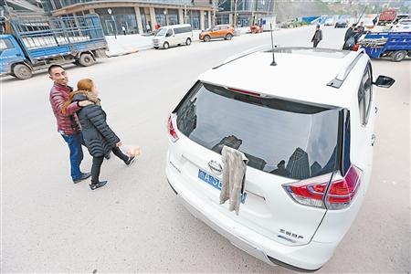 洗车毛巾挂住后雨刮器 电子眼抓拍遮挡号牌扣12分