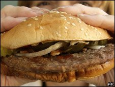 Someone eating a burger