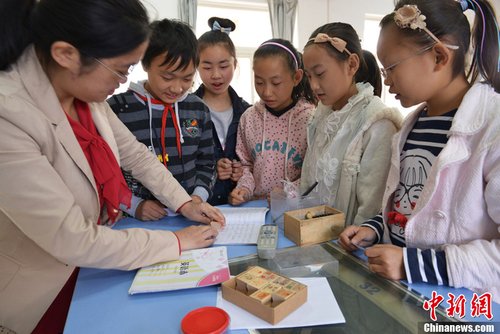 江苏一小学发放作业免做券 表现好可领取