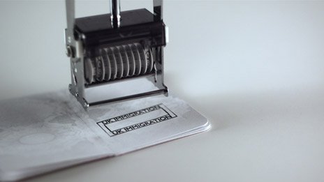 A passport being stamped