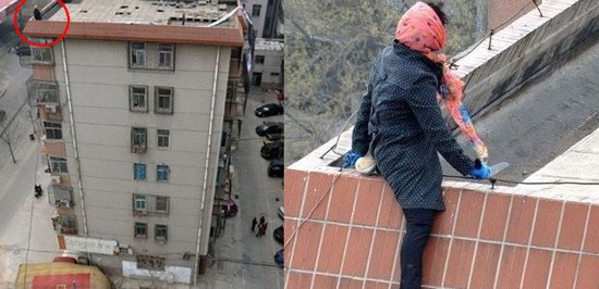 女子挂条幅声讨老公 爬上7楼要轻生