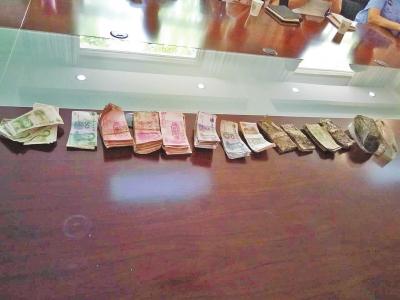 环卫工捡3万多元报警 8人自称“失主”认领