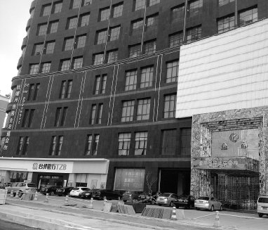 擅自加盖两层 余杭最热闹人民大道上的商厦真