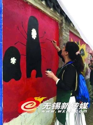 无锡开展集体涂鸦公益活动 以涂鸦赶跑“牛皮癣”