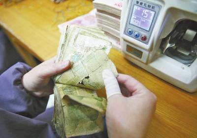 洛阳一企业用残损纸币发电 1吨可发电660度(图)