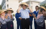 习近平考察海南戴斗笠