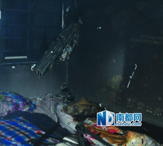 楼层起火男子吊床单逃生 妻子坠亡儿子窒息死亡