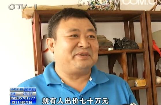 市民海边捡巴掌大 奇石  上有 熊猫  图案 (图)_新