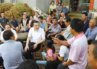 7 members of standing committee go to each district to coach the mass line contacts bit of economy standard each different