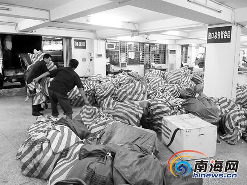 光棍节网购火爆包裹大增 海南快递公司大量招人