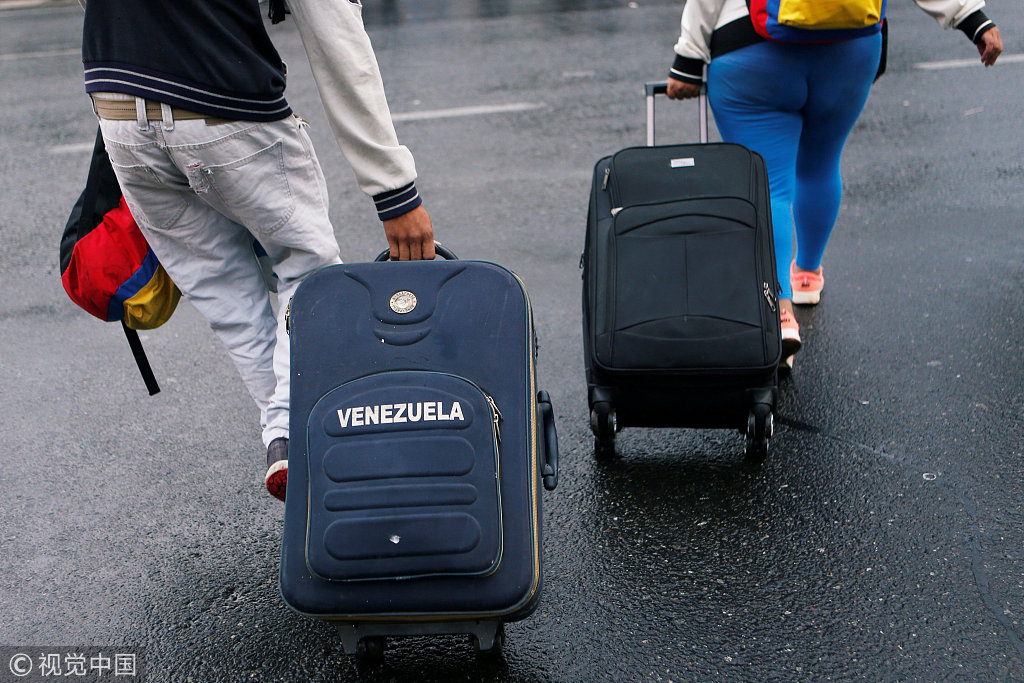 面临经济奔溃，很多委内瑞拉民众选择逃离本国