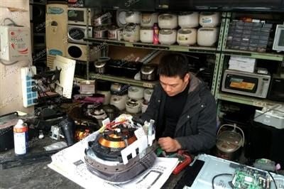 赴日游抢家电后遗症:扛回的电饭煲遇维修难