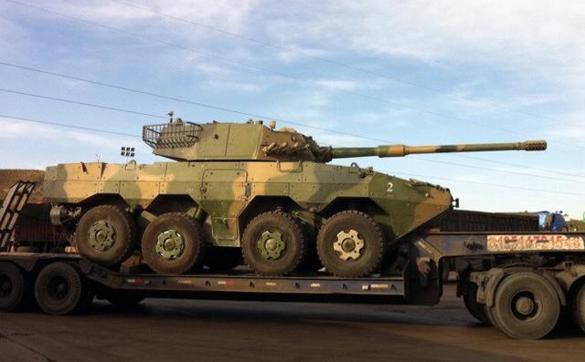 实则是新装备训练与实战贴资料图:09轮式突击炮   5月上旬,第14集团军