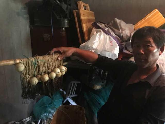 杭州钱塘江边捞尸人:希望每一钩都能落空