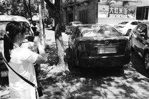 宁波闹市区现蒙面女子 用手机对车辆一通拍